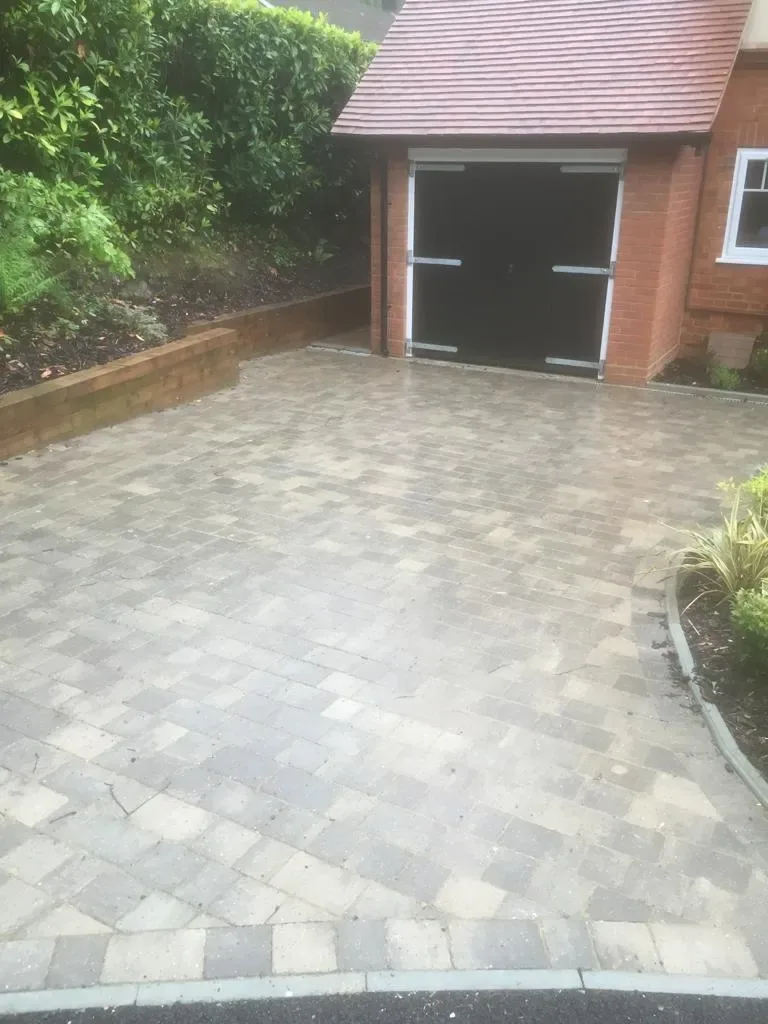 Block paving driveway running up to the front door of a detached house