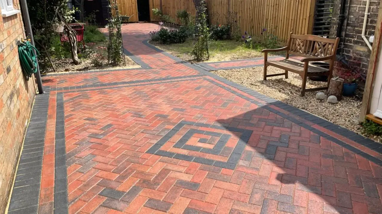 Block paved patio and courtyard with a soldier course border