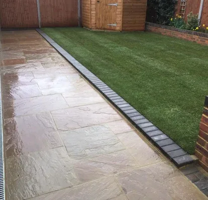 Porcelain paving with a contrasting border course around the terrace