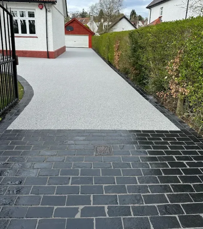 Gold resin bound driveway with a block paved border