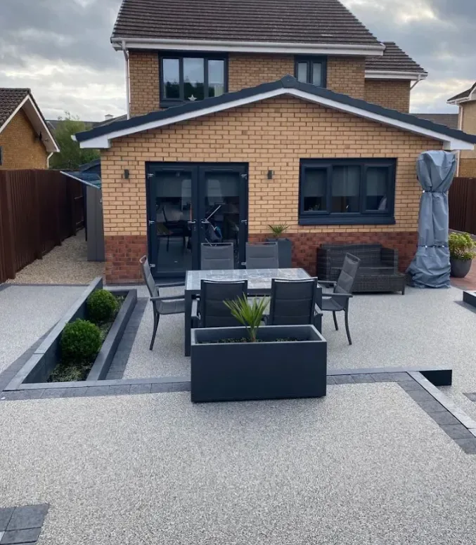 Resin bound patio laid seamlessly across a rear garden terrace