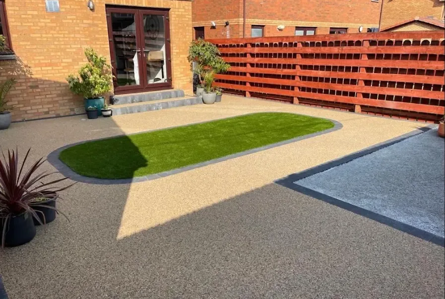 Resin bound patio surface beside planted borders