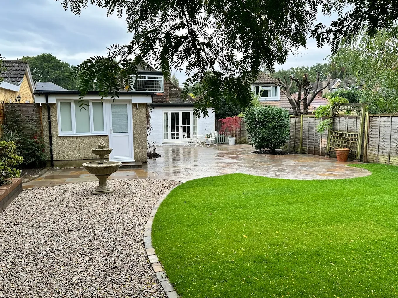 Sandstone patio with a garden path running from the terrace